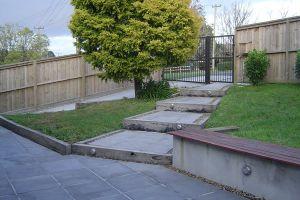 paved outdoor patio timber bench seat 