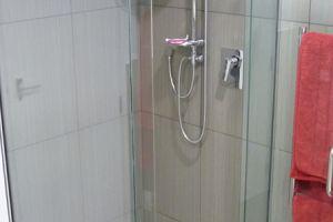 tiled shower frameless glass