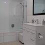 crisp white bathroom with white tiles