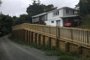 New retaining wall and handrail creating extra parking in driveway.