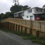 New retaining wall and handrail creating extra parking in driveway.