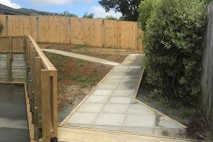 New handrail and paved paths and outdoor areas in backyard