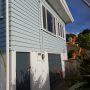 Exterior weatherboard maintenance and painting.