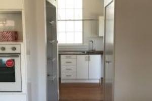 Bungalow kitchen & laundry renovation - new and reconfigured kitchen includes pantry behind kitchen and new laundry beyond.
